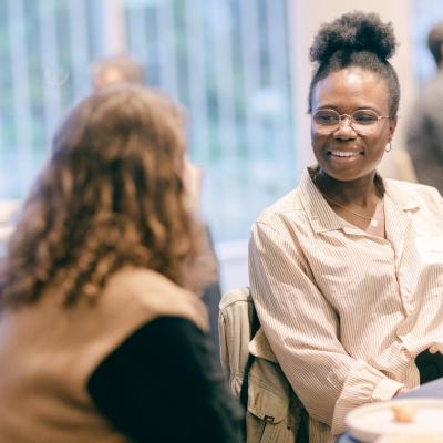 two people talking at an event